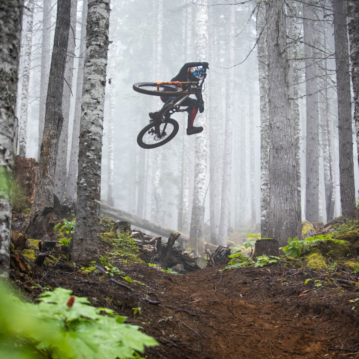 Jackson Goldstone riding through a forest